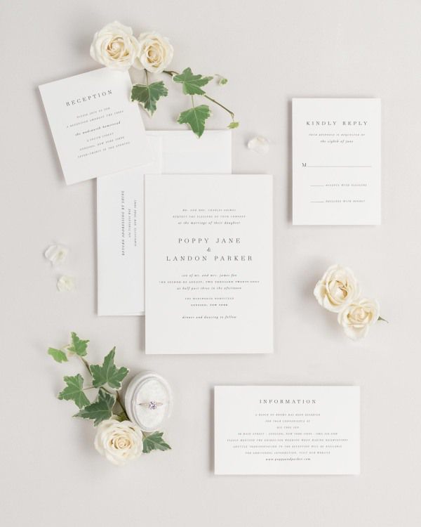 Poppy wedding invitations flat lay with
