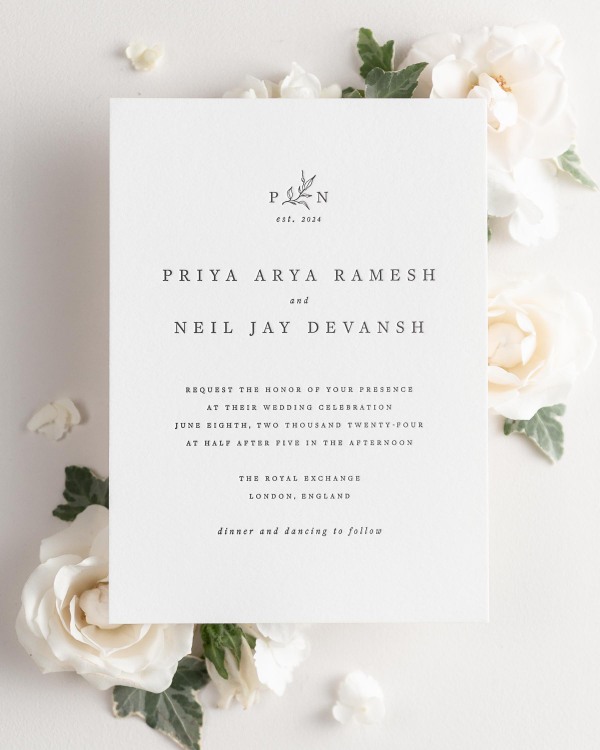 Priya letterpress wedding invitation styled with pretty florals.
