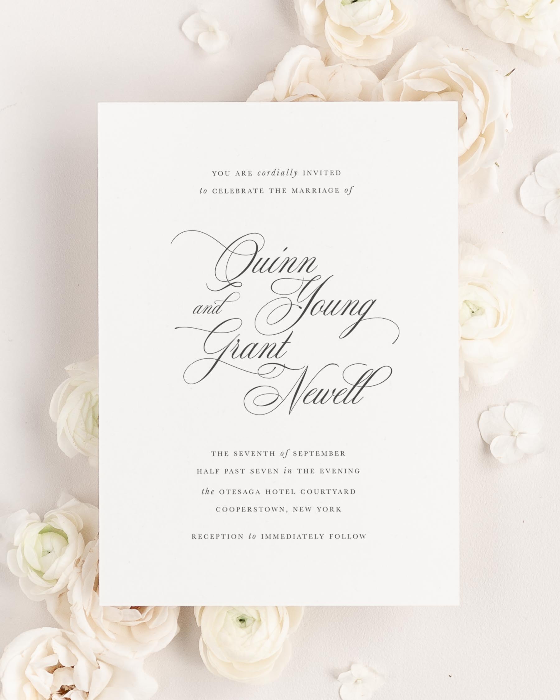 Quinn wedding invitation framed with dreamy florals.