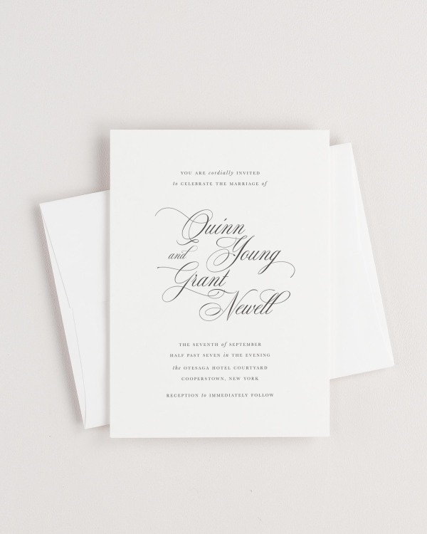 Simple close-up of Quinn invitation with an envelope.