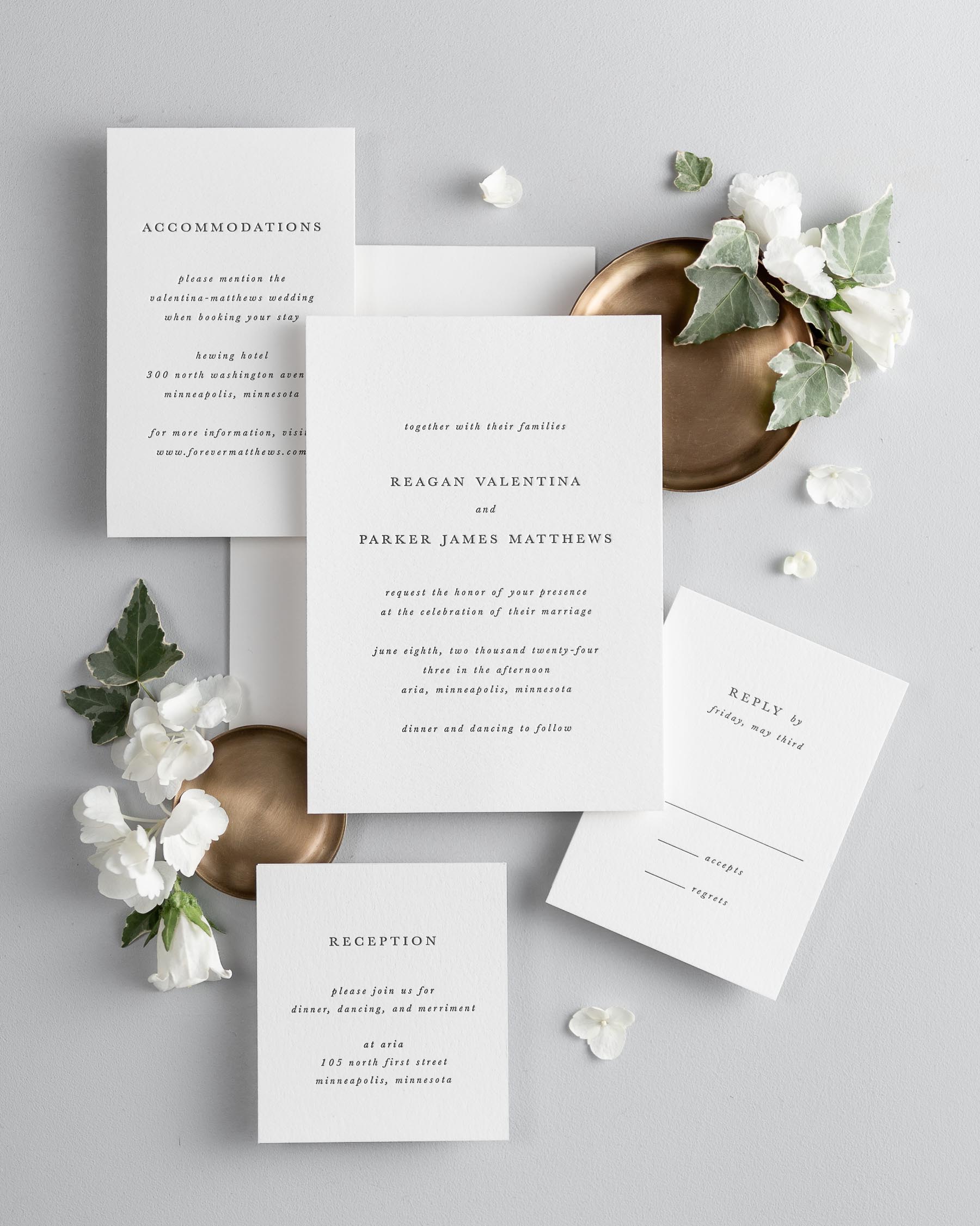 All pieces of the Reagan letterpress wedding invitation suite, including the invitation, small and large enclosures, and response card.
