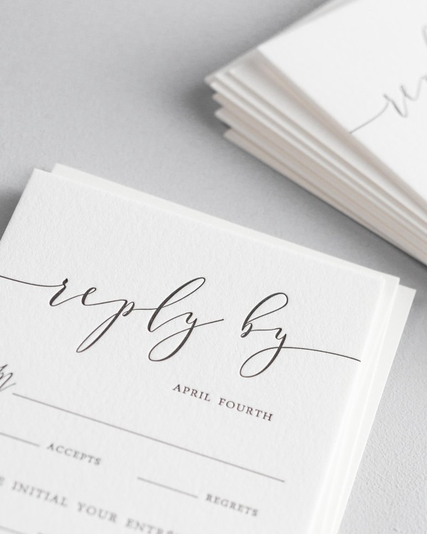 Dreamy close up shot of Romantic Calligraphy response cards. Deep impressions in the paper are a result of the letterpress printing process.