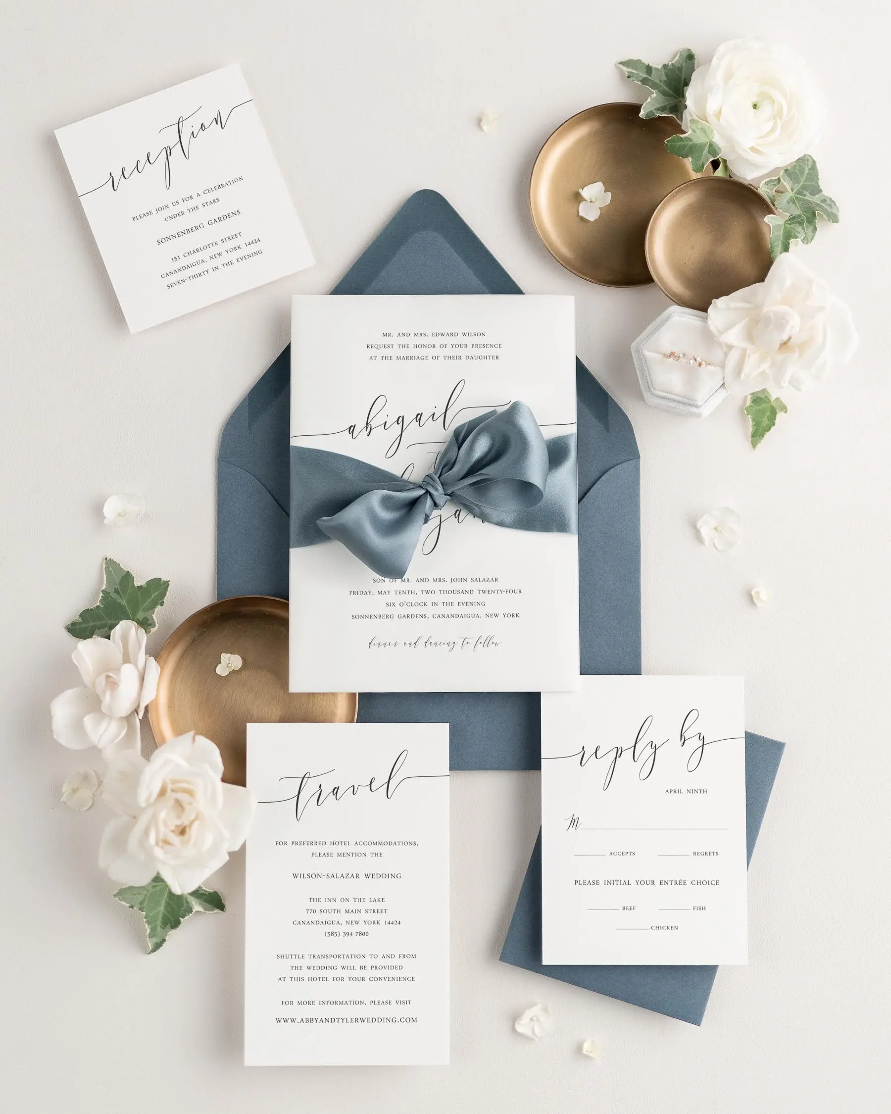 Steel Blue Ribbon Tied Around a Romantic Script Wedding Invitation