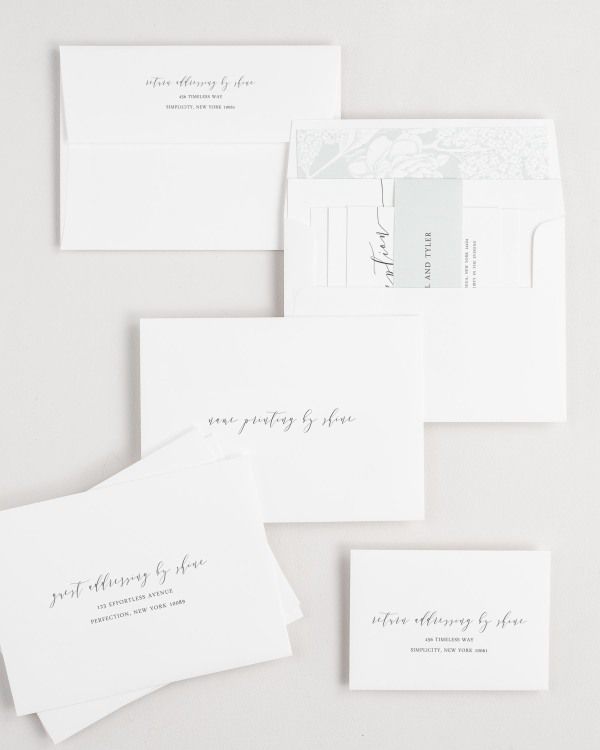 Romantic Calligraphy wedding invitation envelopes with guest addressing, return addressing, and name printing services. Inner envelope features a hydrangea liner and sea salt belly band.