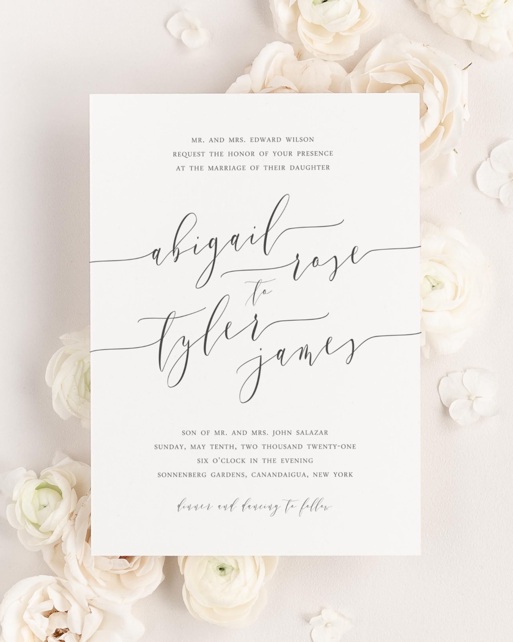 Romantic Calligraphy wedding invitation framed with dreamy florals.