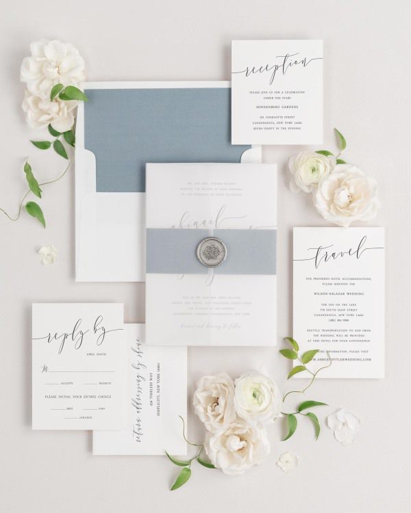 Romantic Calligraphy wedding invitations flat lay with mineral solid liner, mineral belly band, translucent vellum jacket, and silver florette wax seal.