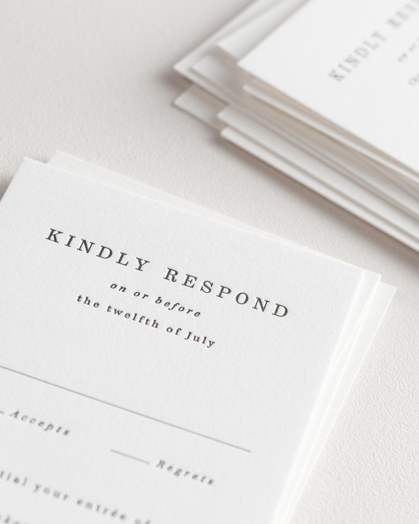 Dreamy close up shot of Savannah response cards. Deep impressions in the paper are a result of the letterpress printing process.