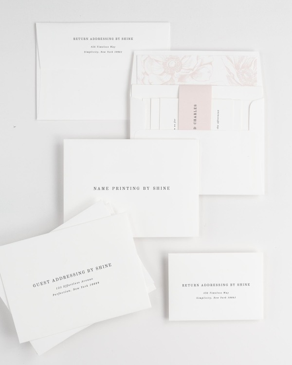 Savannah wedding invitation envelopes with guest addressing, return addressing, and name printing services. Inner envelope features a anemones liner and vintage blush belly band.