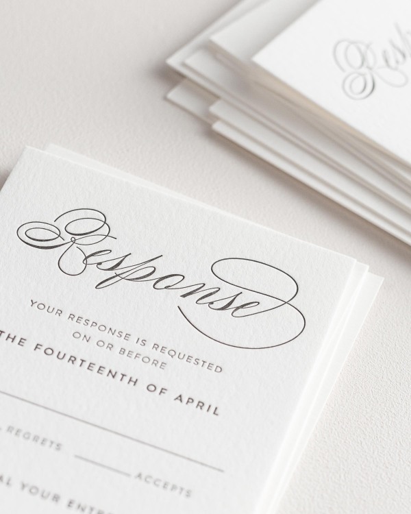 Dreamy close up shot of Script Elegance response cards. Deep impressions in the paper are a result of the letterpress printing process.