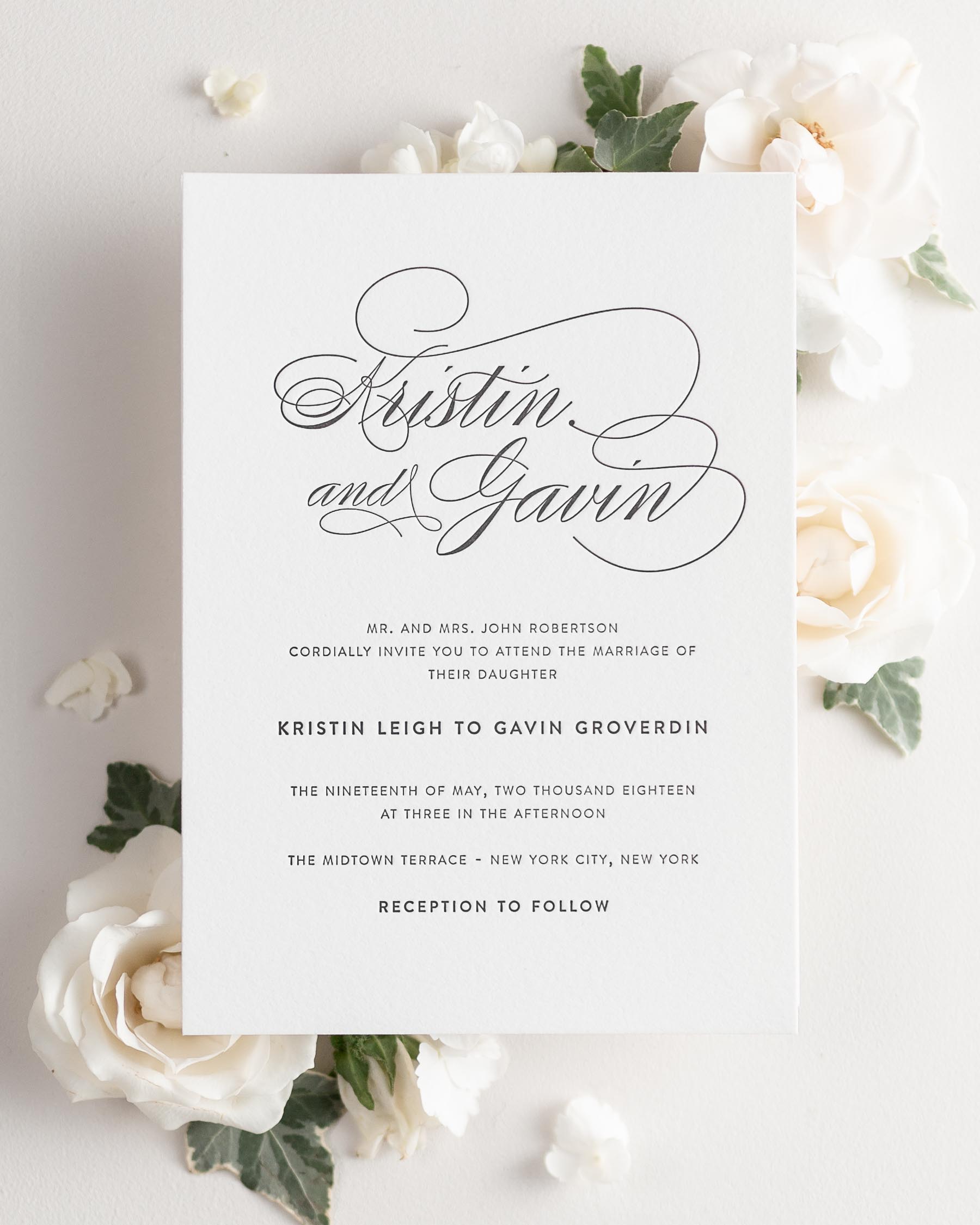 Script Elegance letterpress wedding invitation styled with pretty florals.