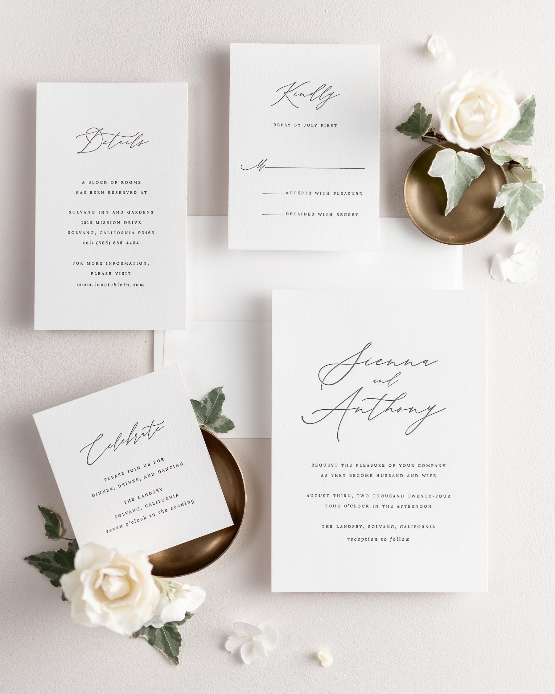 All pieces of the Sienna letterpress wedding invitation suite, including the invitation, small and large enclosures, and response card.