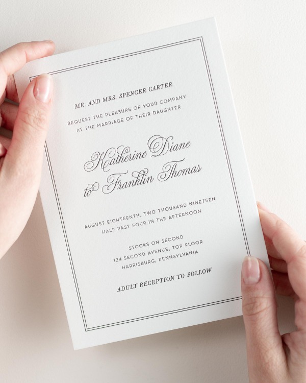 Bride holding her 5x7” Simply Classic letterpress wedding invitation.