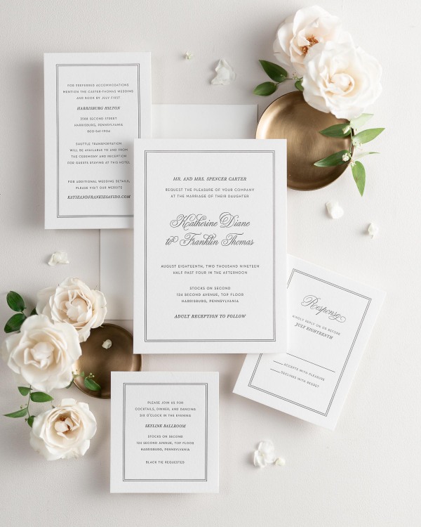 All pieces of the Simply Classic letterpress wedding invitation suite, including the invitation, small and large enclosures, and response card.