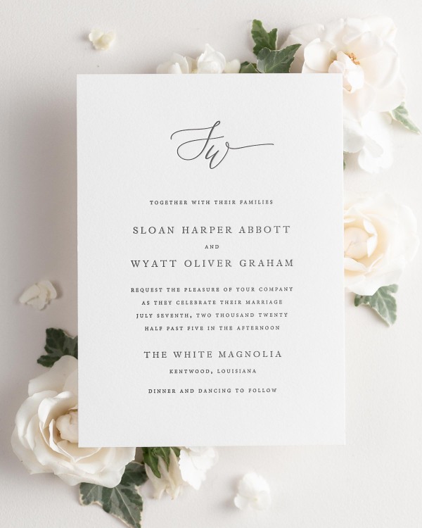 Sloan letterpress wedding invitation styled with pretty florals.
