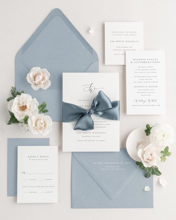 Wedding invitations with silk ribbon and light blue envelope