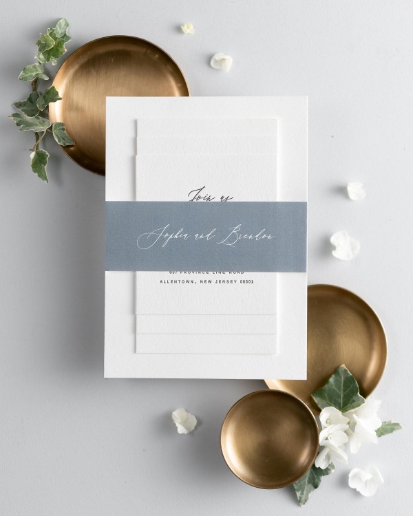 Sophia letterpress wedding invitation suite stacked and wrapped with a personalized Mineral belly band.