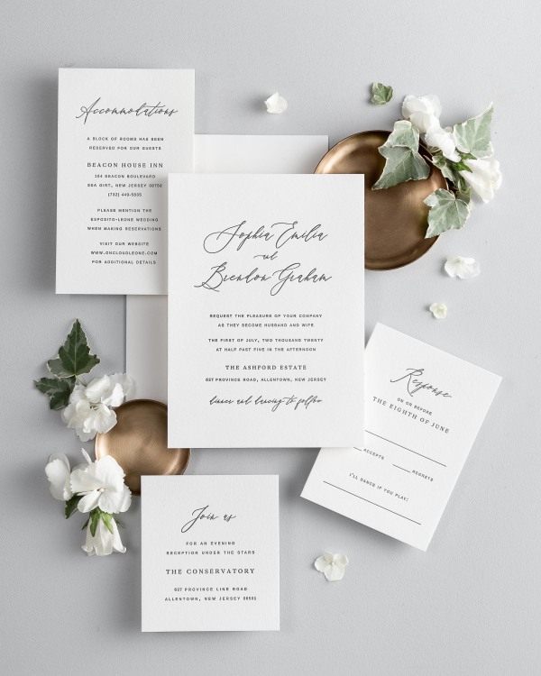 All pieces of the Sophia letterpress wedding invitation suite, including the invitation, small and large enclosures, and response card.