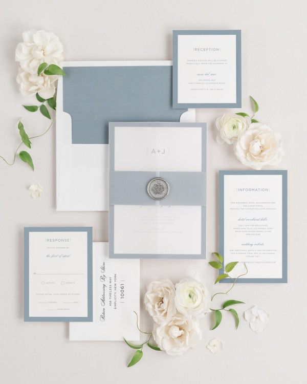 Sophisticated Modern wedding invitations flat lay with mineral solid liner, mineral belly band, translucent vellum jacket, and silver florette wax seal.
