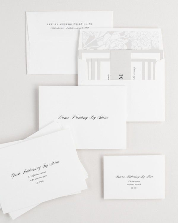 Upscale Monogram wedding invitation framed with dreamy florals.