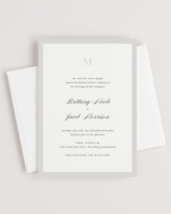 Upscale Monogram wedding invitation framed with dreamy florals.