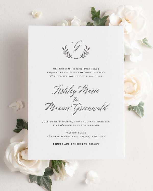 Wreath Monogram letterpress wedding invitation styled with pretty florals.