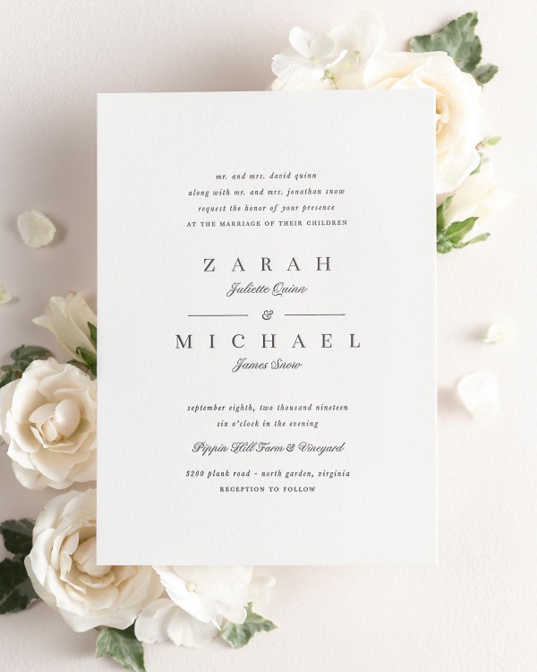 Zarah letterpress wedding invitation styled with pretty florals.