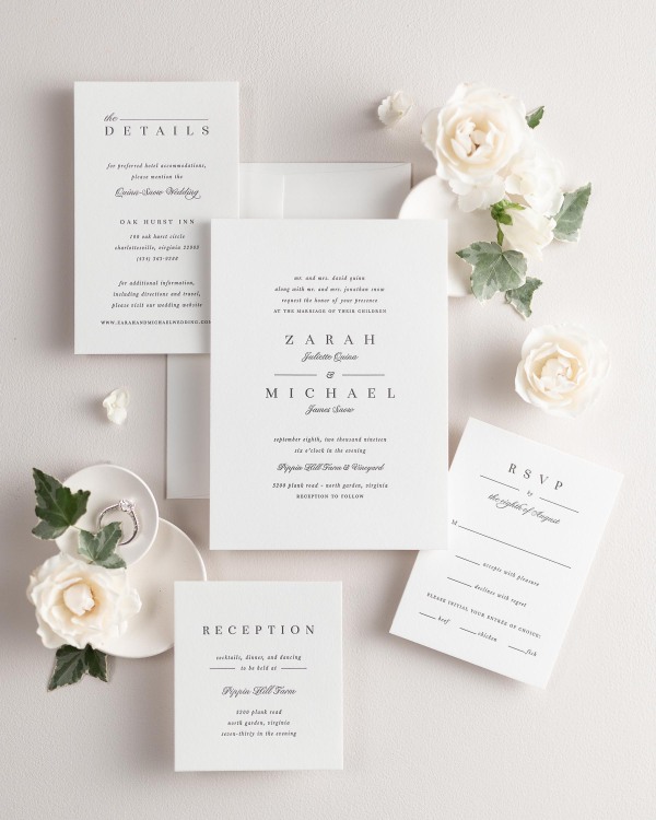 All pieces of the Zarah letterpress wedding invitation suite, including the invitation, small and large enclosures, and response card.