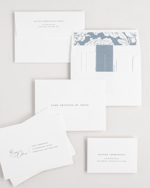 Zoey wedding invitation envelopes with guest addressing, return addressing, and name printing services. Inner envelope features a blooms liner and mineral belly band.
